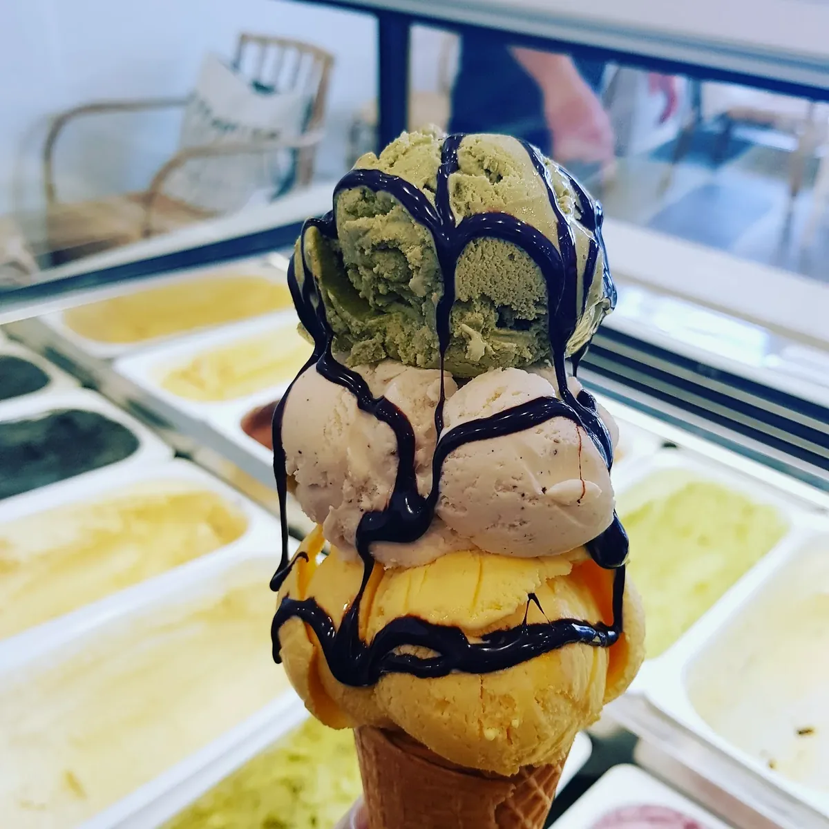 Their crumbed chicken sandwich with a shake on wide screens, a gelato cone on phones